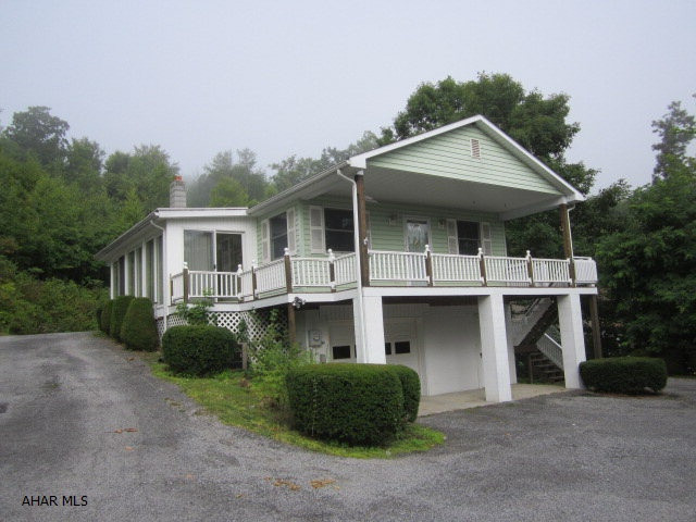 Beautiful country setting with 5 1/2 acres. Newer ranch home with upper floor entrance featuring large open kitchen, heated sunroom and finished basement. The basement has a family room or bedroom and 3/4 bath. There is a large detached garage/work shop for all your toys. Home Warranty.