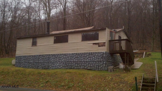 Fixer upper doublewide.  The front porch is rotted, use caution!