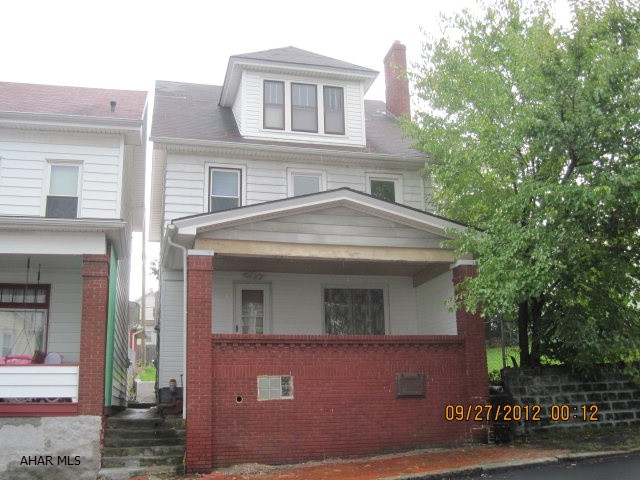 Newly painted, new vinyl flooring and carpet, some new windows. Off Street Parking. Good condition, Energy efficient furnace. First floor laundry. Fireplace closed up.