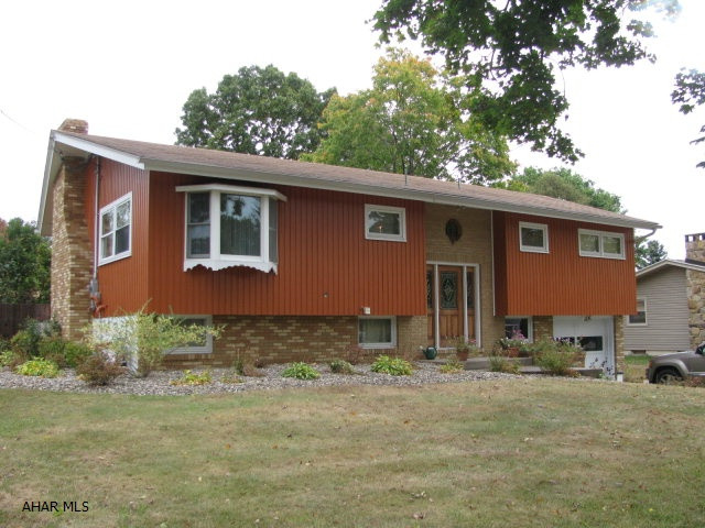 Quality built & well maintained bi-level in Tipton, BASD. features spacious LR., w/ vaulted ceilings. HWF, Gas fireplace and french doors to deck. EIK w/ceramic tile floor and island, 3 BR., 2 bath, Lower level family room w/ fireplace and wet bar! All on a spacious fenced lot with above ground pool w/large deck!