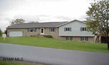 All new floor plan and fresh decorating.  Large rooms.  Nice screened-in deck off kitchen. A 3-car garage bay in the basement.  $3,000 landscape allowance.  1st floor laundry.  Main bath has whirlpool tub & skylight.  2.5 baths on the 1st floor and 1 full bath in basement.