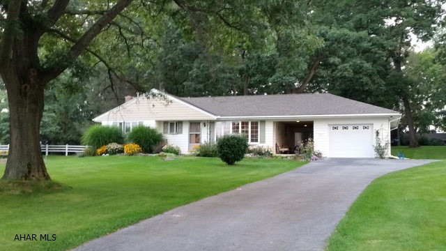 Nice home with hardwood floors, beautiful location with nice mature trees, blacktop drive, breezeway, family room with corner fireplace. Ductless mini-split air conditioner & heat pump wall mounted plus oil hot water heat. #J-264