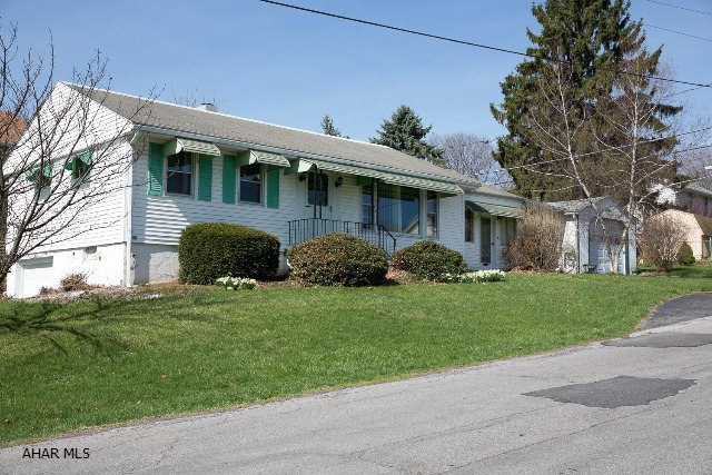 Lot's of potential in this home!  Hardwood floors in the living/dining/bedrooms.  1 car garage under the home with a driveway and a detached 1 car garage with driveway.  There is also a shed on the property.  The carpet was just recently pulled up.  With some TLC the potential is incredible!  Please bring a flashlight as the utilities are off. Breaker box and sub panel located in basement.