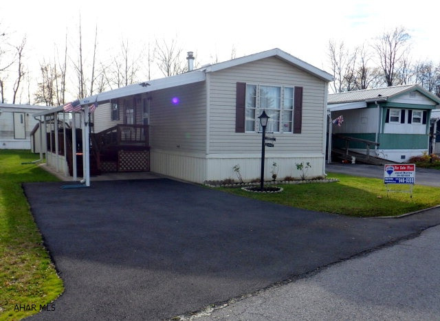 1990 Fleetwood 14 X 70 - 2 BR, 2 BA, LR, E-I-Kitchen With Breakast Bar, Propane Stove, Refrigerator, Master BR Suite W/Walk-In Closet & Full BA, Garden Tub And New Shower, Main BA W/New Toilet, Laundry Room.  Vaulted Ceilings Throughout, Rear Porch, Covered Front Deck And Carport, New Blacktop Driveway - Many Updates...$19,900, Allegheny Township.