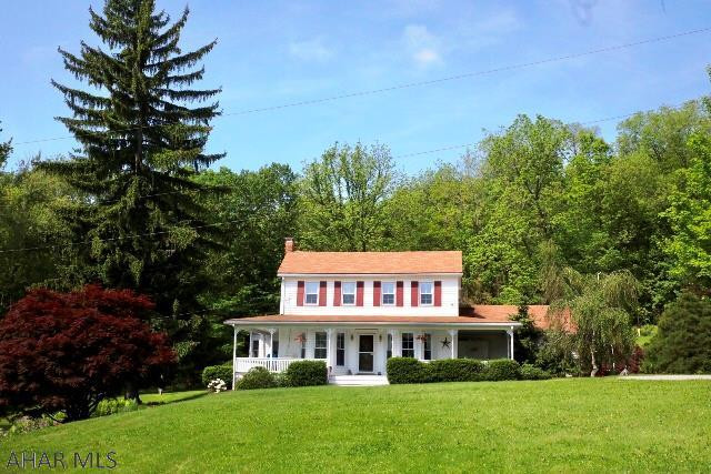 One of the finest homes in Bedford County! This beautifully restored, circa 1860 center hall colonial offers mountain and water views and is situated on 18+acres, and just outside of charming Schellsburg borough. The entire house has been rebuilt from the studs, reinsulated, updated throughout with energy-efficient items, while maintaining the original charm. Spacious rooms, 2 master suites(one on main floor and w/separate entrance), wrap around covered porch, 30'x14' in-ground pool, pond, 32'x28'detached 2 car garage with finishable upstairs, 40'x16'barn and several additional outbuildings, gardens of berries, 3 fireplaces (one not in use).  Hundreds of thousands dollars spent on restoration!  Located between Bedford and Flight 93 Memorial, minutes to Shawnee Lake.