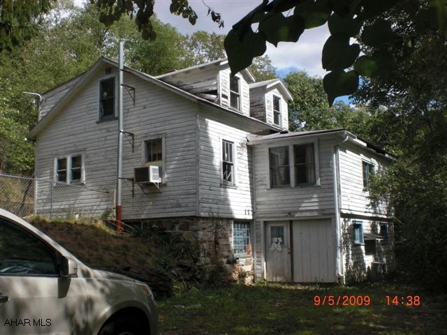 In need of some work. Nice secluded area.