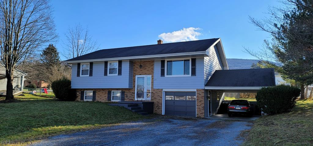 Beautiful bi-level at 1209 Jackson Avenue in Altoona. Cedar and brick 3 bedroom, 1.5 bath.  Gas baseboard hot water heat with central air. 1+ car integral garage with 1+ carport.  102x120 lot with fenced back yard.