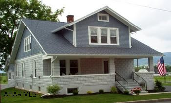 Large Martinsburg Borough home , extra lot, new kitchen w/granite tops. New baths, large rooms and storage closets. Unique woodwork throughout, new Simonton low UV double tilt-in windows, new roof gutters and downspouts, new carpet, tile flooring. Natural gas on the lot, furnace convertible (insert) for oil. The heating system is an automatic-augur-feed pea-coal furnace that also supplies the home's hot water: Hot water heater back-up. Furnace can be converted to oil for approx. $2000. Natural gas on lot cost would be $3000-$4000 to convert. A $2700 UGI rebate is available towards the installation. Seller credits available to buyer for either conversion. New windows qualify for the $1500 tax credit. Water/Sewer $29.33 mo. Heating $130.00 mo.(approx) Electric as used.