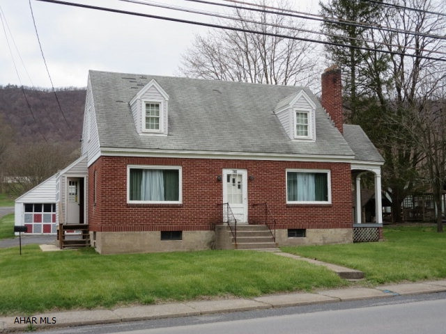 Nice brick 3 bedroom Cape Cod. Located on edge of Everett Borough close to downtown. Hardwood floors throughout. Public water and sewer. Two car detached garage.