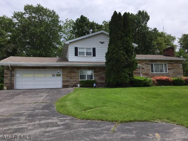 Spacious 4 level split features new SS kitchen appliances, new hardwood floors in living room and dining room, tile entranceway with double closet, FR with half bath and sliding door to private covered patio.  Every bedroom has a double closet.  Freshly painted inside and out.  Three zone GHWBB heat with heat pump.  New mini split heat/AC units.  8000 watt gas generator.  New roof in 2014.  Tilt in windows.  Two car attached garage PLUS two car detached garage with carport.  Don't miss seeing this fantastic property!