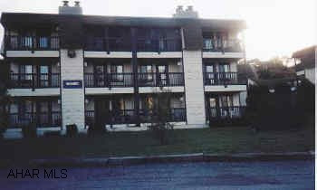 3rd floor 2BR condo, Assoc Dues of $175/mo includes trash, cable, exterior maintenance, use of pools and tennis courts.