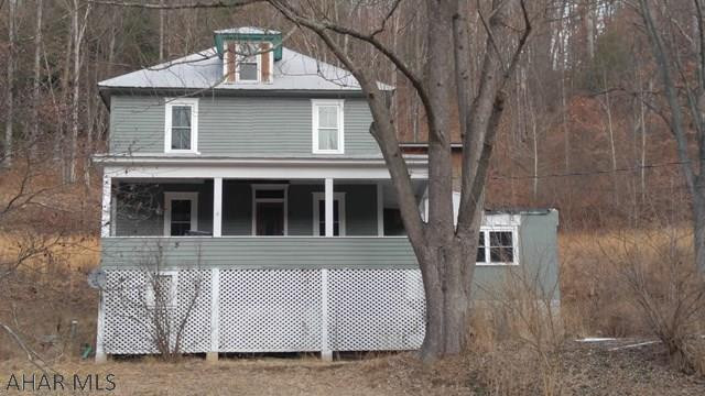 Large 1760 sqft home and 3 bay garage with a loft sits on 2.92 acres. This property has endless possibilities.  Home renovation was started but not completed. New triple pane windows with active warranty were recently installed, along with a new well pump and some electrical.