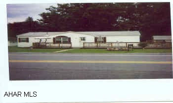 2001 Fleetwood Double wide - wrap around deck, garden tub. Extra building on lot could be garage.