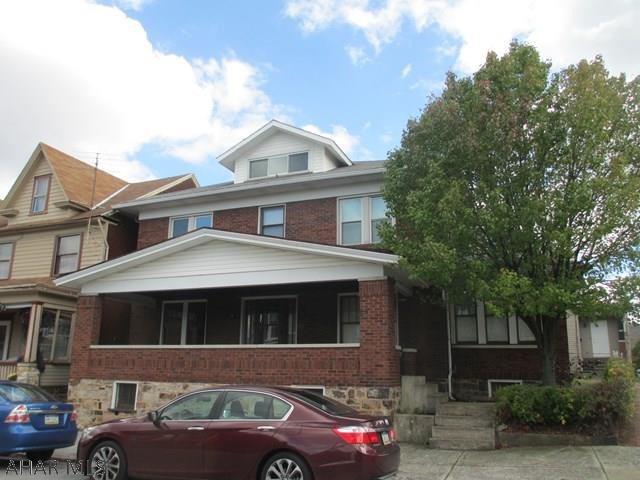 Spacious 2 story home that offers 3 large bedrooms. Beautiful hardwood floors throughout, with a large 2 car detached garage. House could use some TLC that has tremendous potential.