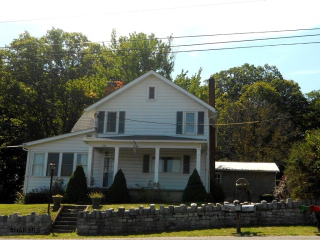 Don't miss out on this family home. This house has the potential for 5 bedrooms, one on the main floor with a bathroom. Much love and laughter have filled the rooms and yard. Rear sun porch, front covered porch. Large trees and 2 detached garages. Home has a newer roof, windows and updated electric system. Large inviting rooms, kitchens has tile floor, carpet in all other rooms. Call to see this one!