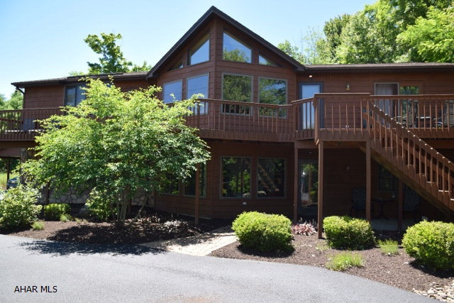 Incredible one of a kind contemporary style home with open concept main level.  Great room with giant windows, gas FP, and cathedral ceiling is open to kitchen and dining area.  Master bedroom with balcony and very large master bath. Sunroom. Beautiful berber carpeting throughout.  Many upgrades to home in 2010.. new furnace, AC, oversized hot water tank.  New roof 2015. New 400 ft. asphalt cap on driveway.  Central vac.  Small fenced area for pets. 2 car garage plus carport for two additional vehicles. Back up generator in case of power outage.   Lovely, private setting on 2 acres. Ground includes 3 separate lots. Additional lots could be sold individually if desired.   HOME WARRANTY INCLUDED!!!
