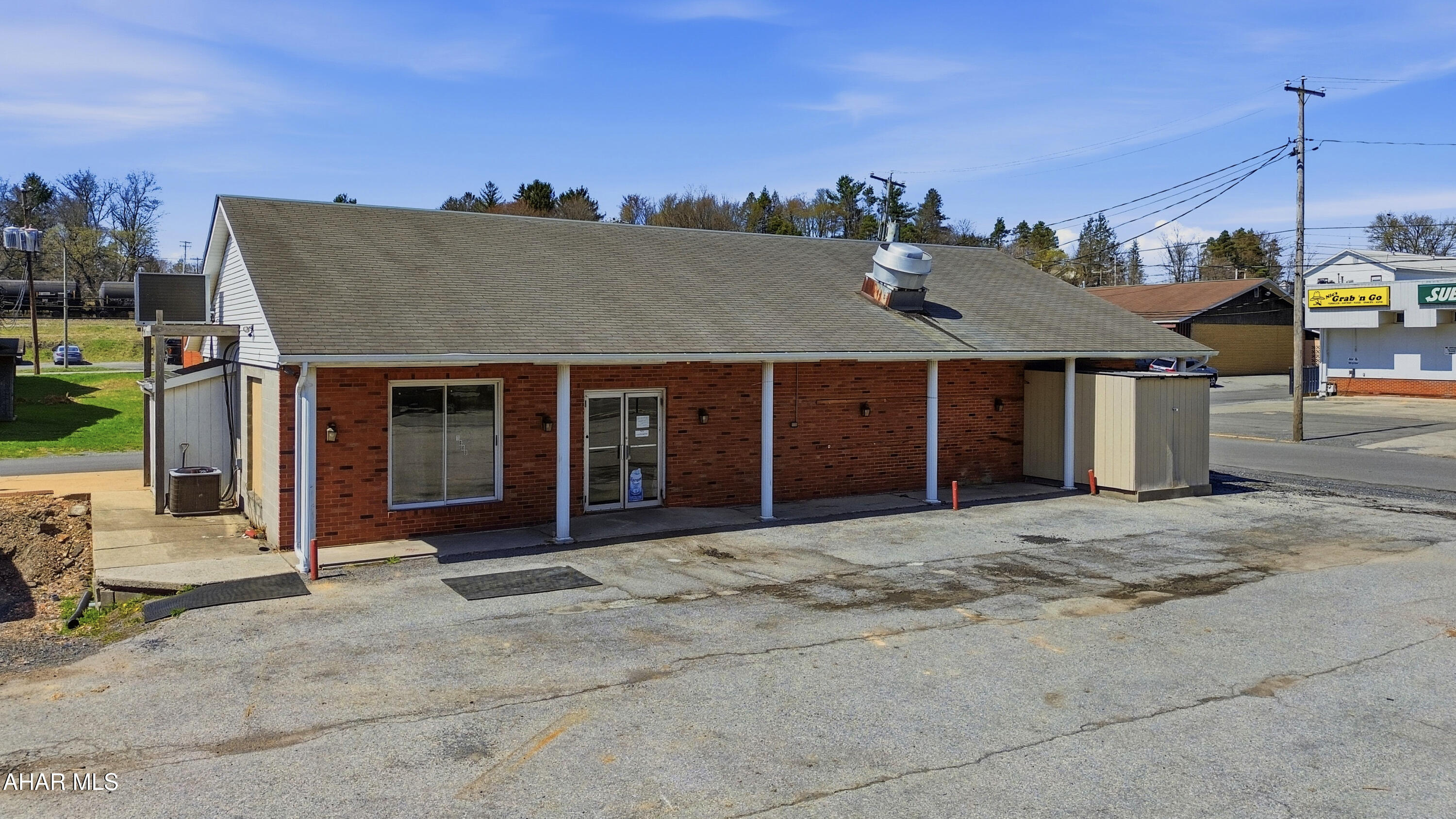Prime commercial opportunity in the heart of Cresson! This highly visible corner property is positioned in a high-traffic location and offers ample on-site parking for customers and employees. Surrounded by established businesses - including a busy laundromat, grocery store, liquor store, pharmacy, Sheetz, and more - this location benefits from consistent daily foot and vehicle traffic. Previously configured for a restaurant and beer distributor, the building offers a functional, open layout that could be easily adapted for a variety of commercial uses. Whether you're looking to open a retail store, restaurant, office, or service-based business, this flexible space provides excellent potential. Recent updates include improved lighting, newer furnace, ceiling tiles, and additional cosmetic improvements. Take advantage of this prime location and bring your business vision to life. Call today for more information!