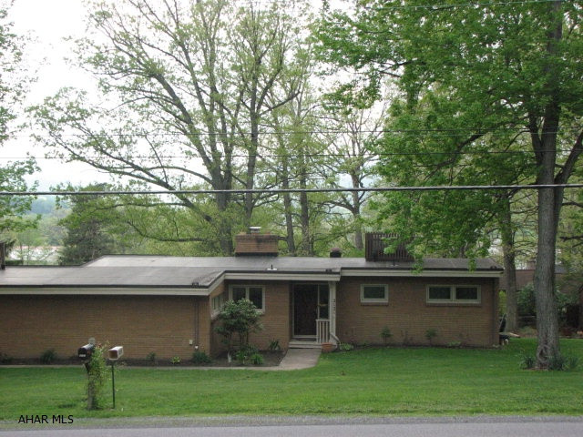 A spacious, rolling rancher with approximately 2800 of square feet.  Updated kitchen and baths, great open floor plan, first floor laundry, fireplace and central air.  This home is in move in condition, with a lots of windows and light.  The sun room is versatile and could be used as a dining room, office, an additional 4th bedroom or recreation area.  Below grade offers a wet bar with range and refrigerator, brick built in shelving, bathroom and huge 43 x 22 recreation area.  This home offers great space and storage.  This is one of those home that you can not appreciate the space, by looking at it from the outside!