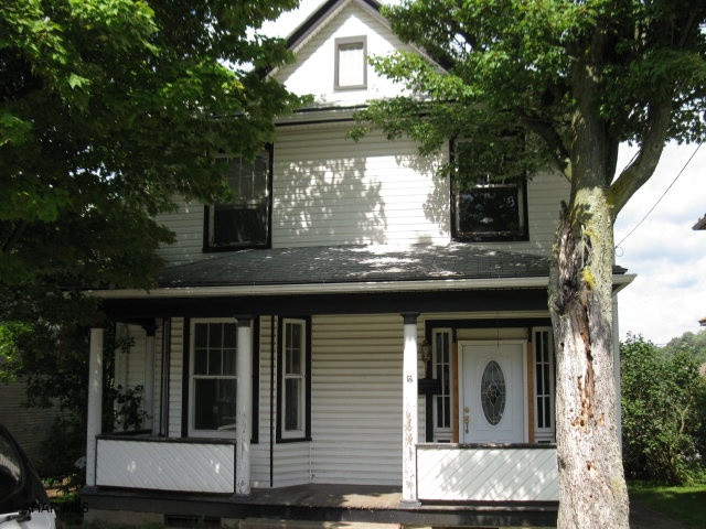 GREAT FOR HANDYMAN OR INVESTOR.  VICTORIAN/QUEEN ANNE CHARM WITH 2 BAY WINDOWS AND ORIGINAL FIREPLACE MANTEL. ALLEY ACCESS AND OFF STREET PARKING. VINYL SIDED 4 BED HOME PARTIALLY UPDATED NEEDS TLC AND FINISH WORK.  POSSIBLE FREEZE DAMAGE.  BEING SOLD AS IS. 3/4 BATH IN BASEMENT.