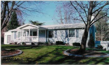 Totally remodeled new addition of sun room/dining room, new carpet, new vinyl flooring, professionally landscaped.