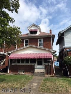 PERFECT FOR RENOVATION LOAN!!!!!   This solid brick 3BR 1BA has much potential.  It NEEDS A KITCHEN AND BATH  but offers nice sized rooms and an extra enclosed front porch and a fenced yard w/ 2 car detached garage.  Great original woodwork throughout the home. 2nd floor has thermo windows. Could be a great 1st time home w/ a reno loan. Seller will make no repairs. Definitely worth a look!  Please look past all of the personal property to see the true potential.