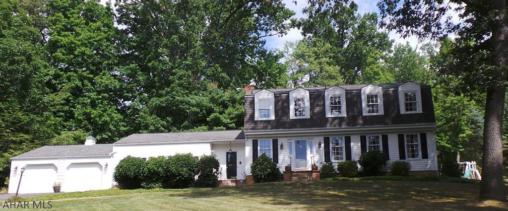 So much room to entertain indoors in the 2 main level family rooms or outside in the large heated sunroom.  This home on 1.33 acres offers hardwood floors, 4 bedrooms 2.5 baths, formal dining room, 1st flr office and a finished bonus room in the lower level.  The kitchen offers lots of cabinets, all appliances and bar seating.  1 Family room w/gas fireplace and wet bar, 2nd family room offers bar w/ mini fridge. No commission on seller assist.