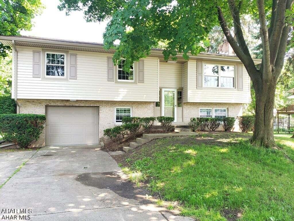 Charming Bi-Level home on a quiet dead end street. On the Main Level you will be greeted by Natural Light from the Newer Windows, a lovely Eat-In Kitchen, Dining Area, 3 spacious bedrooms, and a Beautifully  Remodeled Ceramic Tile Full Bath w/ lots of storage for Linens and Toiletries. Enjoy the Fresh Air on your No-Maintenance Trex Deck off the Dining Rm. The Lower Level features a Family Room w/a cozy Brick Fireplace, 3/4 Bath, Storage and Sliding Doors that lead to the Spacious Flat Back Yard. Kitchen features a large brand new sink and all Appliances. This home is Sided with Quality Insulated Siding for lower Heating/Cooling bills! The entire home has been Freshly Painted & Carpets Cleaned for its new owners! Just Move Right in and make this Sweet Home Your Own.