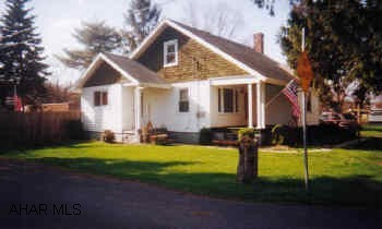 Cape cod, vinyl siding, new roof, replacement windows, all appliances, 2BR and 1 captive. All appliances included, roof replaced 5/02, 2 story barn, privacy fence, backyard, HW floors under carpet.  Owner is licensed Real Estate Agent.