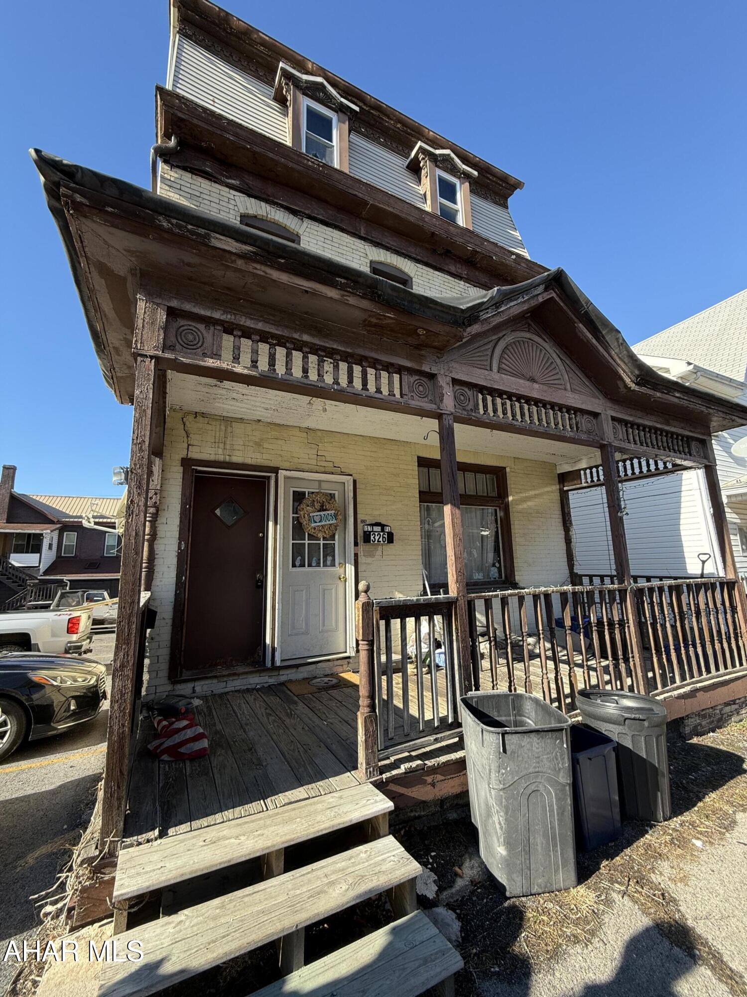 Brick duplex features two separate units, each consisting of two bedrooms and a full bathroom. The first-floor unit is currently leased, with tenants responsible for all utilities. The basement provides laundry facilities for both units.