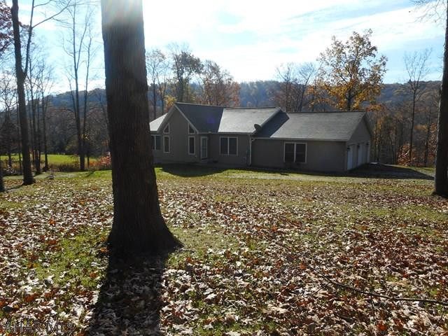 Modular home with superior walls. Beautiful open floor plan with hickory kitchen open to huge living room with cathedral ceiling. Large master bedroom with full bath and walk in closet. Attached two car garage. Three zone oil hw heating, Electric dog fence and generator hookup. Nice country location.
