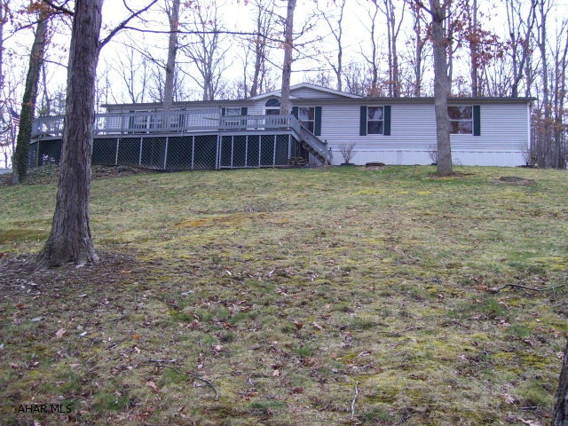 Well maintained double wide with open floor plan. And Cathedral ceilings. With views and Nature all around. Easy access with circle driveway. Stone patio to enjoy the peaceful settings.