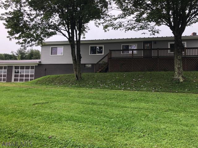 Manufactured 3 Bedroom 2 Bath with new metal roof, new siding, new exterior doors on 3.72 acres.  2 car garage attached.  24x56 barn with stable dividers in place for horses.  Barn has electric and water.  Furnace is 2 years old.  Full basment unfinished.  Easement on North side of property to 40 acre neighboring property.