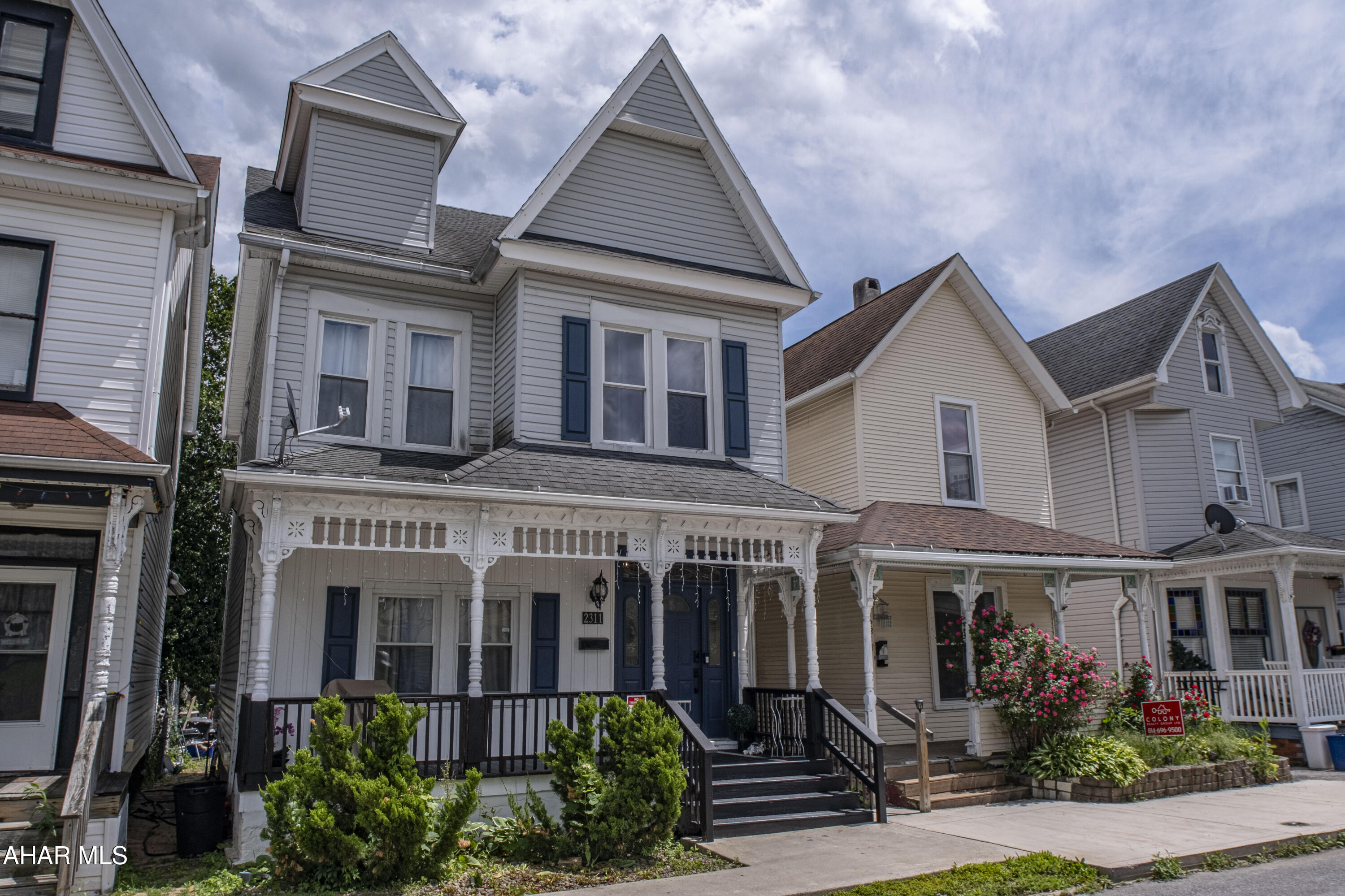 This charming three-bedroom home sits on a quiet street but keeps you close to everything. It features high ceilings, a two-car garage, a fenced yard for off-street parking, central air and a nicely updated kitchen. With an unfinished basement and attic space ready for your ideas!