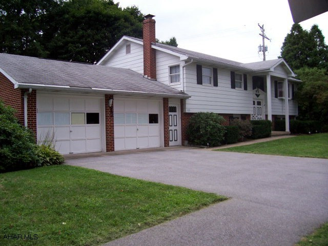 Great mother-in-law suite on lower level with separate entrance and zoned heat. Outside access from lower level into large mudroom.  Great corner lot, super-convenient location.  Separate family room with fireplace on lower level.FULL HOME WARRANTY INCLUDED.  Seller is willing to give a $2000 allowance for upgrades.