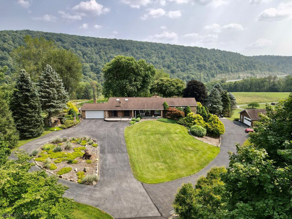 This Beautiful Ranch 3 BR 4 Bath home awaits the person looking for beautiful views, privacy.  1.5 miles from downtown Historical Bedford on 5.38 acres.  This property has plenty of wildlife roaming throughout the property.  And a gentlemen's paradise with six car garages and one has room for 30 plus feet camper.
