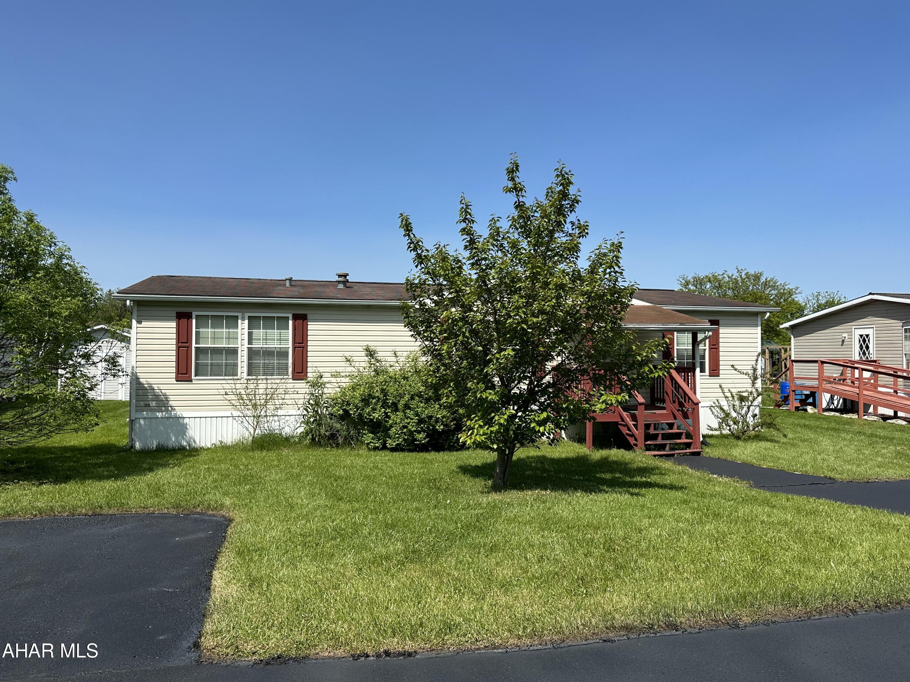 Doublewide on rented lot in 55+ community, Lot rent is $625/month and includes trash, paved parking area, screened in back porch, requires some tlc,  Buyer must contact LGC Independence Place for application legacymhc.com, 412-770-9009. HOME IS BEING SOLD AS IS. SELLER WILL MAKE NO REPAIRS. Buyer to verify taxes.