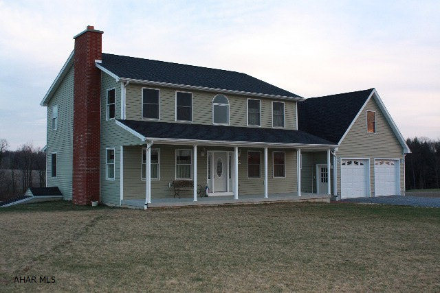 Wow, what a house and Wow, what a garage and Workshop.  There is nothing small about this property.  The house has 2888 sq ft of living space, 1392 sq ft basement, a 24x36 attached 3 car garage with a 24x30 workshop. Just when you thought that is enough, it all sits on 8 acres and is priced to sell at $345900.Take your pick on which porch to sit and swing, covered front porch is 8x36 and covered back porch is 8x30If you think this would cost a lot to heat, think again it has an Electric HVAC Geothermal heat and air condition unit with 2 Zones. Just ask to see the costs.Basement has an extra flu for extra heat source if desired.