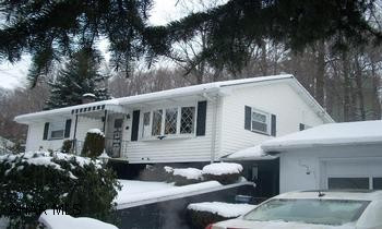 Ranch home, two bedrooms, 1.75 baths, Family room in basement, two car garage. Nice Rnch home in private location, new insulation and newer windows, Call John 329-2621.