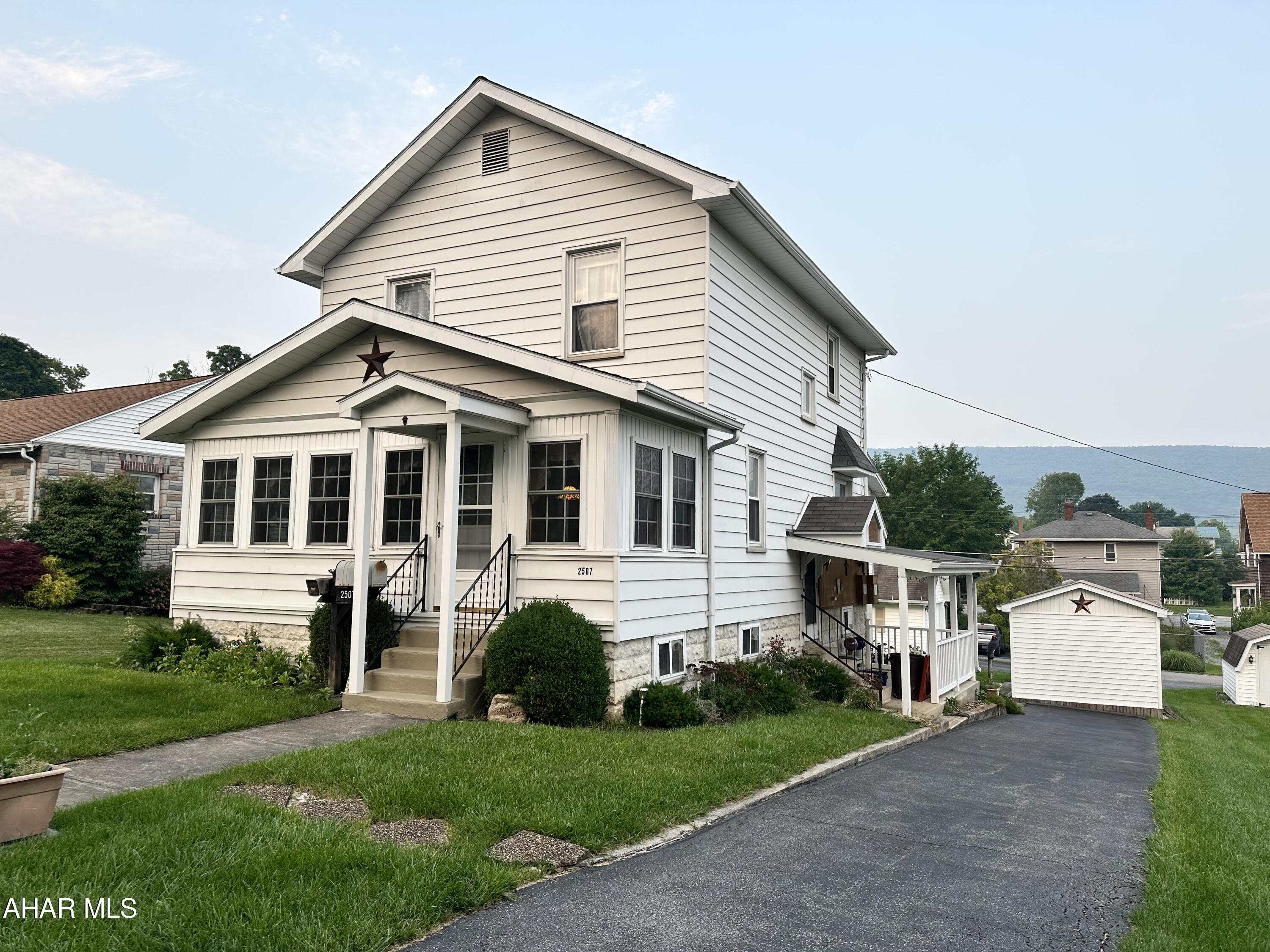 Check out this great neighborhood location, this 3 bedroom 2 bath home also offers an enclosed front porch for additional living space. there are 2 detached garages both with electricity. The seller believes there are hardwood floors under the carpet. Hardwood floors are exposed in one of the bedrooms. there is a finished area in the lower level plus a workshop. Central AC is also a great feature.