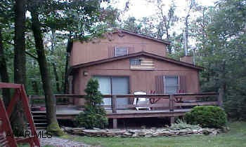 Inviting cottage located in "gated" Buck Run Subdivision. This cottage offers a living room with a vaulted ceiling, kitchenette, first floor bedroomwith walk-in closet, utility room, a second level with two bedrooms. Enjoy the peace and quiet from the front deck of this cottage. Association fee of approximately $60.00 per year. Attic for storage. Furnished.