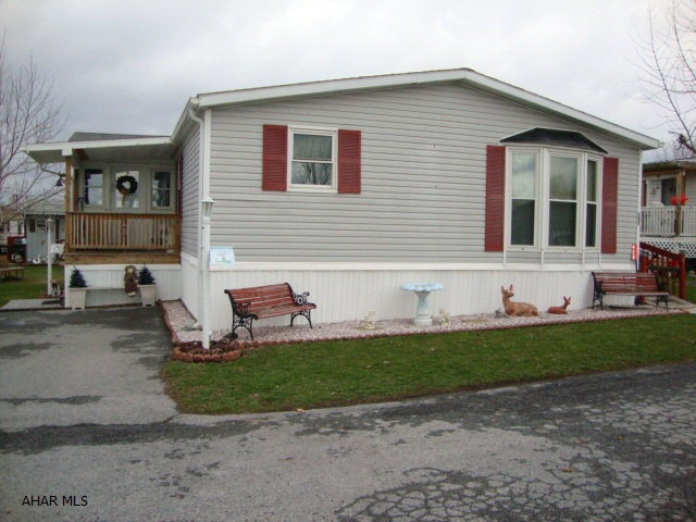 MOTIVATED SELLER WILL LOOK AT ALL OFFERS. MUST SELL QUICKLY!! Beautiful 28 x 80' double wide - Plumbing, hot water heater, water conditioner and C/Air all new within the last 2 yrs. Newer spouting and downspouts, New furnace(2010)  Main living area is drywall, large kitchen with island, five ceiing fans, stone gas fireplace in family room. New walk in shower in master bath and whirlpool tub. Laundry room with half bath. Enclosed Porch and deck with ramp. Well maintained and in good condition. Taxes are in process of being appealed. Contact listing agent for more information. Offer in place contingent on fiancing. Will take back up offers.