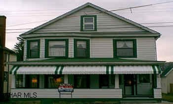 2 story home - presently used as single family...or could be a duplex...13 rooms- Kitchen up and down - Electric Heat on 2nd floor.  Could be converted to gas - ducts are there.  Separate utilities available.