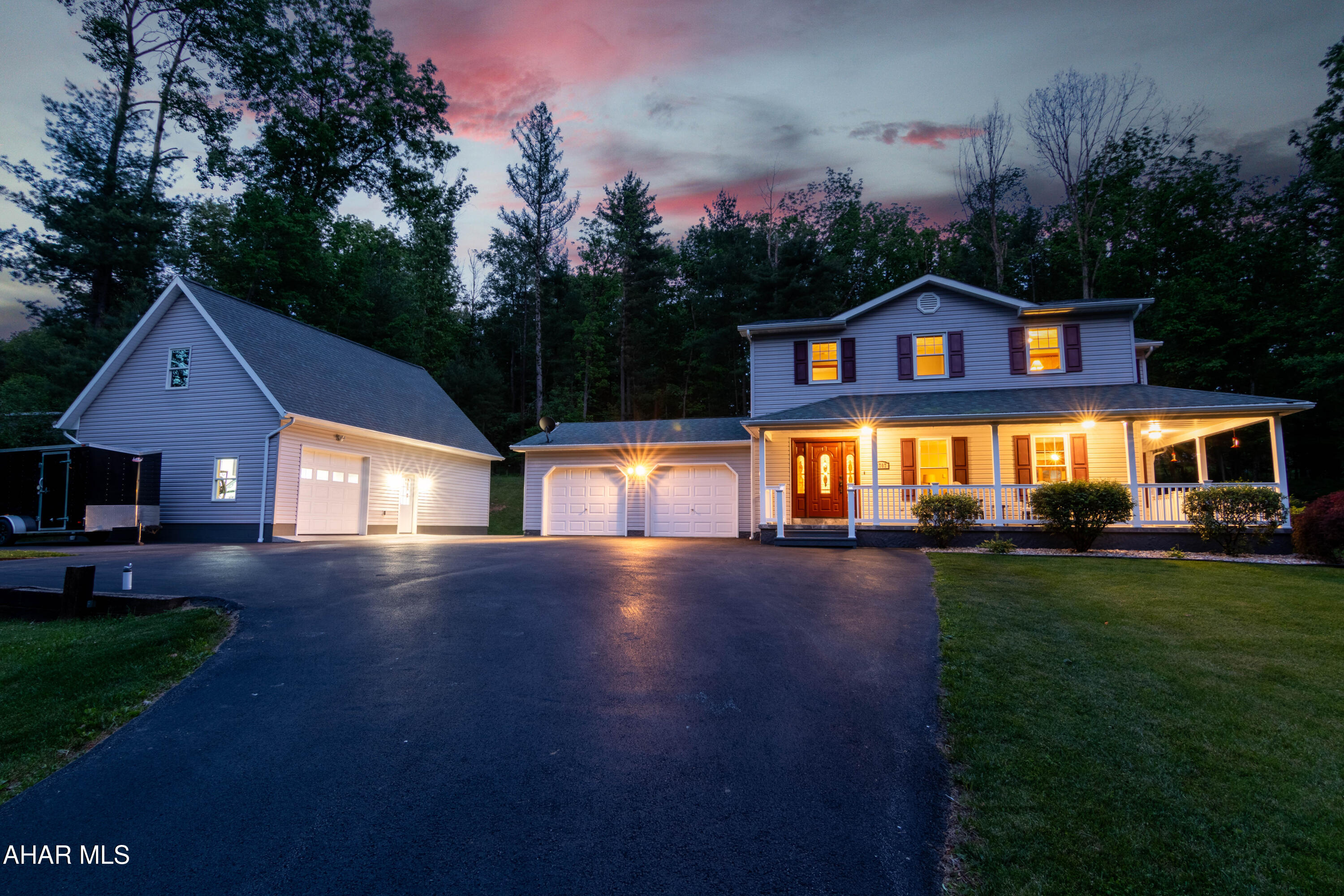 Welcome to this well-maintained home in a country setting offering a blend of comfort, updates, and exceptional garage space. Recent improvements include remodeled bathrooms, fresh interior paint, updated appliances, a mini-split system, driveway improvements, and landscaping enhancements. The spacious interior features comfortable living areas, a functional kitchen with ample cabinetry, and a beautifully updated primary bath and guest bathroom. Flooring was replaced in the entire home with LVP/LVT. Thoughtful updates throughout provide a move-in-ready feel while maintaining the home's character. Outside, enjoy the covered wrap around front porch overlooking the scenic setting. A standout feature of this property is the garage and workshop space, including an attached 2-car garage and a detached 1-car garage for a total of 3 garage spaces. Above the detached garage is a finished workshop area, offering excellent flexibility for hobbies, storage, projects, or workspace needs. Call to schedule your showing!