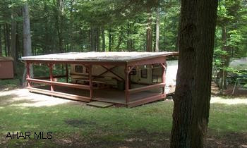CITATION CAMPER W/ DECK, ROOF, SHED, ON EXTRA LARGE CAMP SITE IN PRIVATE AREAC-132 NICE AREA FOR KIDS TO PLAY , SETS OFF MAIN ROAD