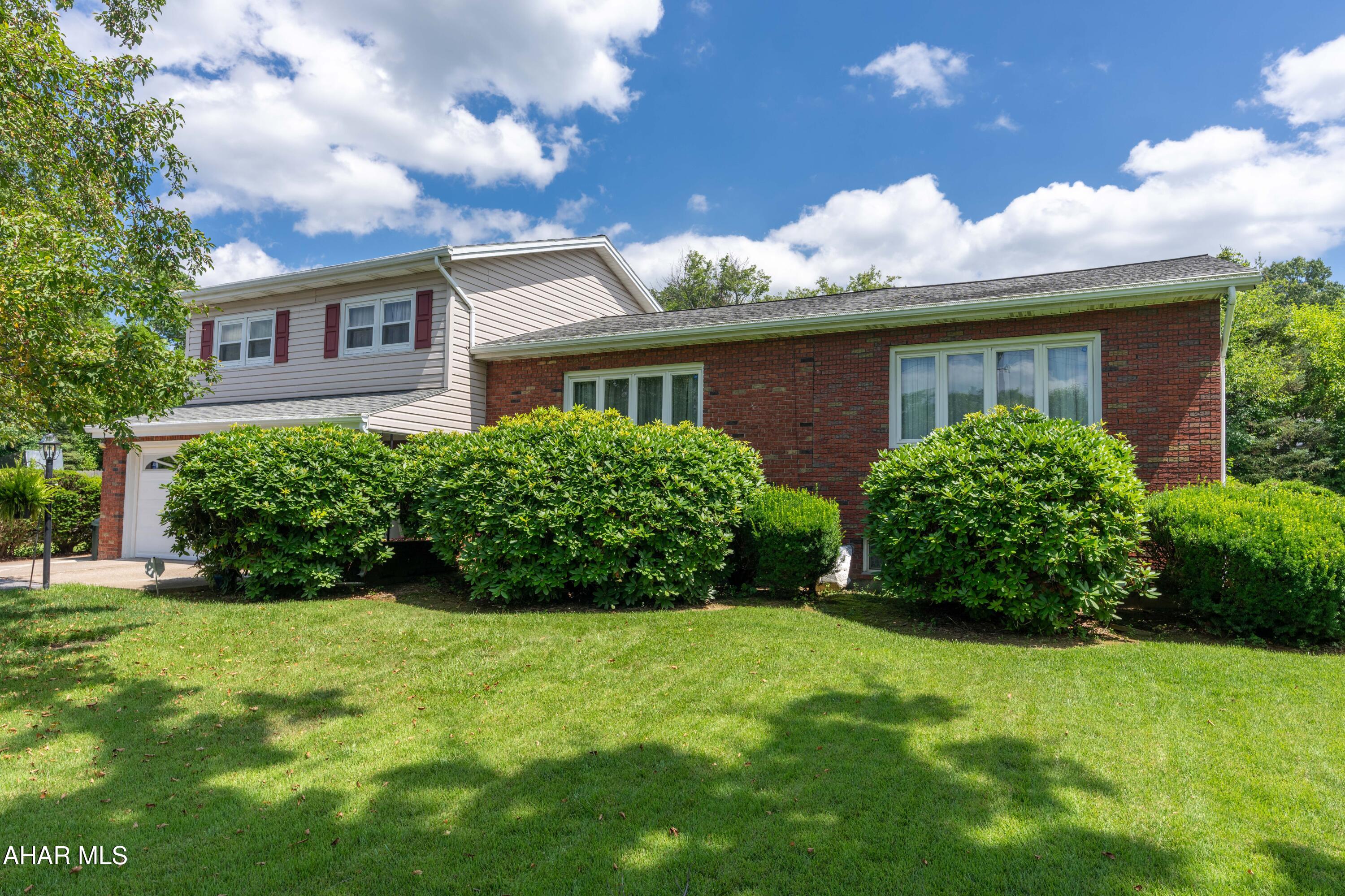 You won't want to leave this outside area! This immaculate multi-level, 4-bedroom, 2.5 bath home with attached garage is perfect for anyone. First floor owner's bedroom with a large owner bath and walk-in closet. Plenty of entertaining space with an inground pool, patio, and finished basement with bar area. This home has everything you could want and more.  Come view the multiple options for living and family rooms with an eat-in kitchen area and make it your own.