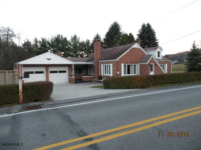 Brick ranch w/ 2 car garage, fireplace in the living room & den.  Summer kitchen & family room in basement