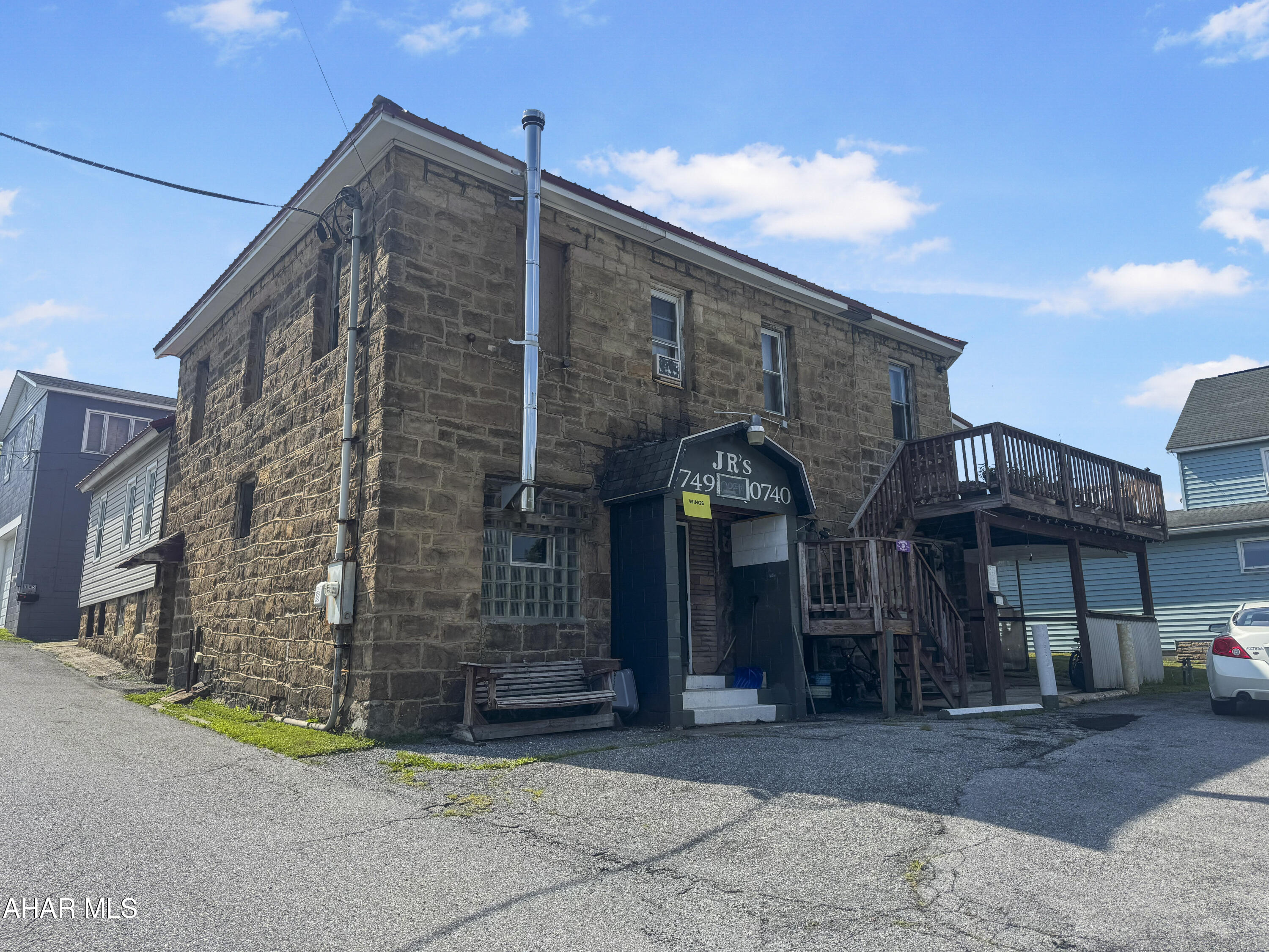 Here's your chance to own a fantastic restaurant/bar complete w/ two residential units! The main level, previously known as ''Bar JR,'' is fully equipped for restaurant use, but the possibilities are endless, allowing you to transform the space into additional rental units, a hair salon, a tattoo shop, & more! The two apartments are both currently rented, providing a steady source of additional income, w/ the bottom unit featuring 2 bedrooms & 1 bathroom, & the top unit boasting 3 bedrooms & 1 bathroom. This property comes w/ valuable amenities, including off-street parking & a durable metal roof, plus it includes essential kitchen equipment & much more to get you started! Don't miss out on this incredible opportunity, call today!