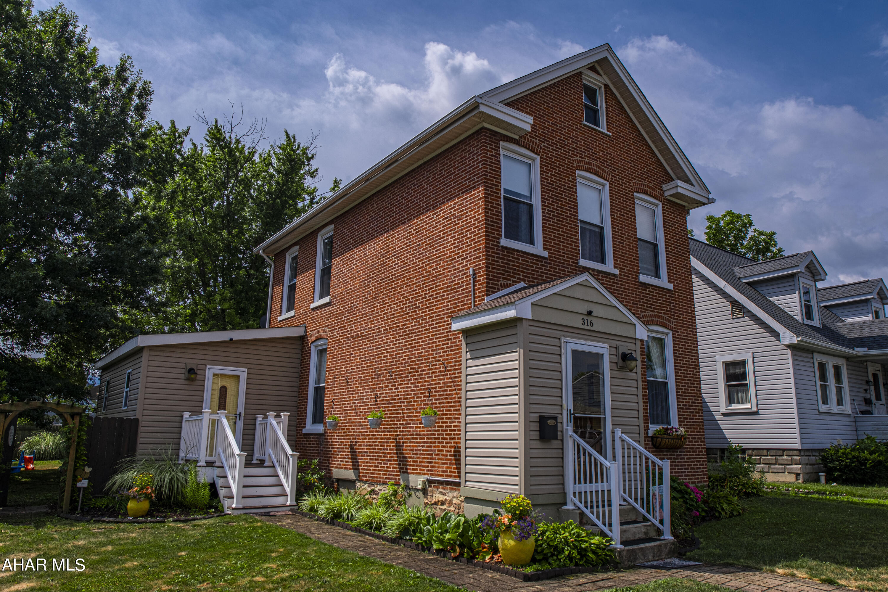 Welcome home to your beautiful historic 3 bedroom, 1.5 bathroom brick home in the heart of Hollidaysburg Borough. This home features many upgradesand renovations while still preserving it's original charm. The spacious bright kitchen is open to the dining room, and large bonus mudroom/laundry room with a 1/2 bath included. The 2nd story features 3 bedrooms, a full bathroom, and a walk-up attic with plenty of storage. The huge fenced in backyard oasis is perfect your pets, children and for entertaining guests, including a large composite deck that easily fits a patio set, propane firepit, or even a hot tub! There is off street parking out back and a large shed for extra storage. This home is within walking distance to Hollidaysburg schools, the track, playgrounds, and downtown music/restaurants. Schedule your showing today!!