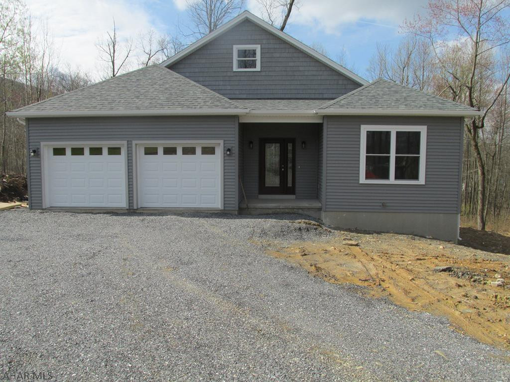 Convenient location - Beautiful Brush Oaks Community with mature trees and sidewalks.  Lovely Custom Downsizer - Everything New!  From garage walk into laundry area with walk in closet and right into the kitchen with all your groceries.  Foyer is 6'9" X 15'9"  Great open floor plan, open to great room, dining area and kitchen.  Light bright kitchen with granite counters stainless steel appliances.  Full daylight basement, could be finished for another family space.. Deck 15 X 12 Just the right size!!  Garage is 22'x22' Poured foundation - This property is a partially wooded private lot.  Pre-Paid Items:  Homeowners Capitalization Fee - 400, Buyer/Homeowner is responsible.