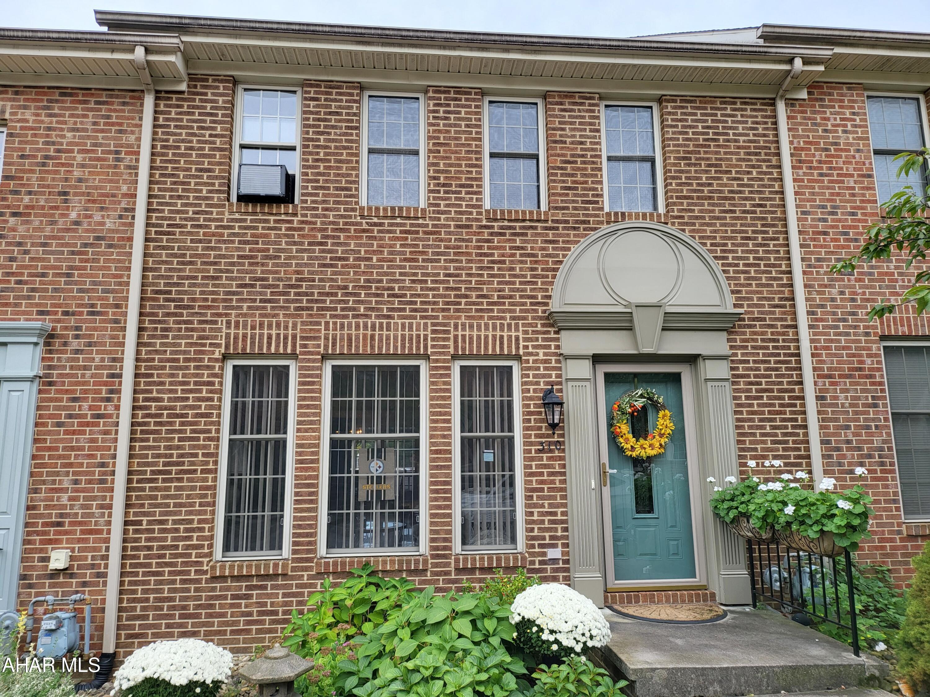 Immaculate two bedroom townhome in highly sought after Hollidaysburg Hills within the Borough. This extremely clean home boasts granite, tile, beautiful hardwood and large rooms. The huge two plus car garage has a full second floor, perfect for storage or it served as a wood shop for this owner.